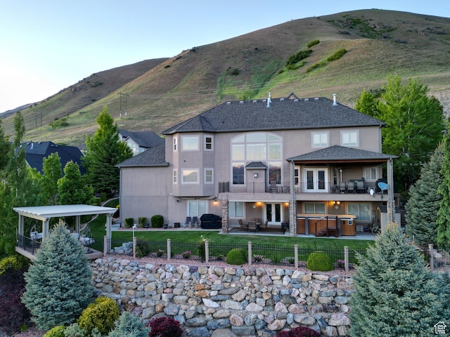 2524 E 700 S, Springville, UT 84663 - exterior space featuring a balcony, stucco siding, a hot tub, and a patio area
