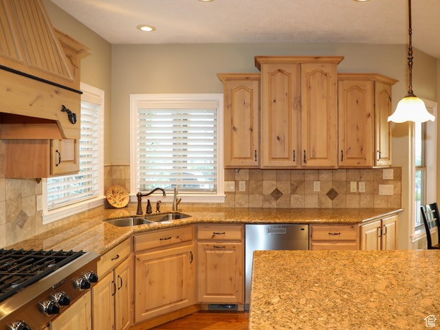 2524 E 700 S, Springville, UT 84663 - kitchen with appliances with stainless steel finishes, a sink, hanging light fixtures, backsplash, and light brown cabinetry