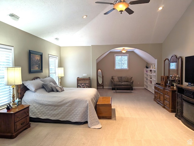 2524 E 700 S, Springville, UT 84663 - bedroom with vaulted ceiling, arched walkways, ceiling fan, visible vents, and light carpet