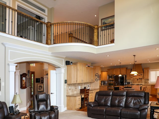 2524 E 700 S, Springville, UT 84663 - living area featuring a high ceiling, arched walkways, and ornate columns