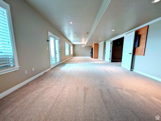 2524 E 700 S, Springville, UT 84663 - unfurnished living room featuring baseboards, a textured ceiling, recessed lighting, and light carpet