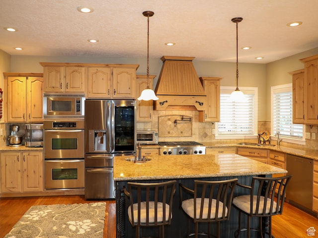 2524 E 700 S, Springville, UT 84663 - kitchen with custom range hood, a sink, stainless steel appliances, and light brown cabinetry