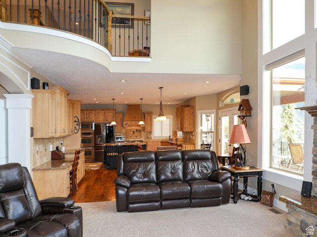 2524 E 700 S, Springville, UT 84663 - living area with dark carpet, a towering ceiling, baseboards, and recessed lighting