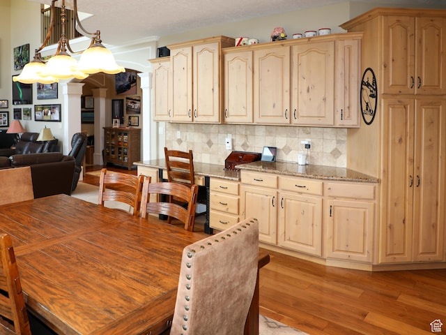 2524 E 700 S, Springville, UT 84663 - dining room featuring light wood-style flooring, a notable chandelier, and a textured ceiling