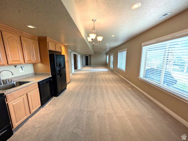 2524 E 700 S, Springville, UT 84663 - kitchen with light countertops, baseboards, a sink, a notable chandelier, and black appliances