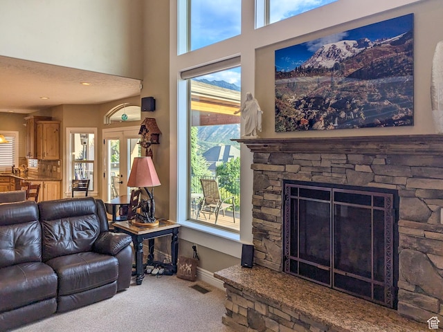 2524 E 700 S, Springville, UT 84663 - carpeted living room with a towering ceiling, baseboards, a fireplace, and visible vents