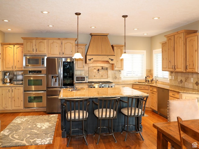 2524 E 700 S, Springville, UT 84663 - kitchen featuring a sink, light brown cabinetry, appliances with stainless steel finishes, light wood-type flooring, and custom exhaust hood