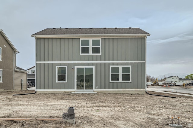 back of property featuring board and batten siding