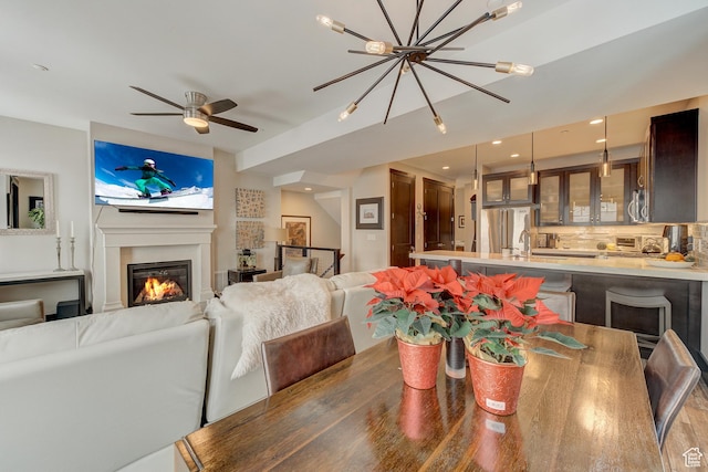 3676 Blackstone Dr, Park City, UT 84098 - dining room with a notable chandelier, a glass covered fireplace, and recessed lighting
