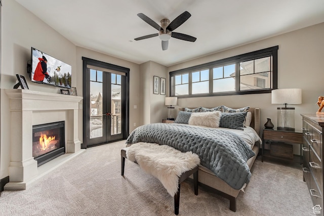 3676 Blackstone Dr, Park City, UT 84098 - bedroom featuring multiple windows, carpet, access to exterior, and a glass covered fireplace