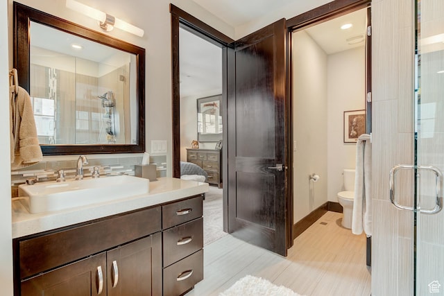 3676 Blackstone Dr, Park City, UT 84098 - full bath with a shower stall, baseboards, toilet, vanity, and backsplash