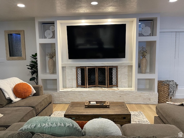 3444 S 1100 E, Millcreek, UT 84106 - living room with recessed lighting, a textured ceiling, built in shelves, and wood finished floors
