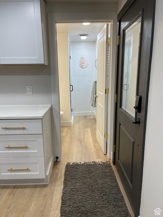 3444 S 1100 E, Millcreek, UT 84106 - hallway featuring baseboards and light wood-type flooring