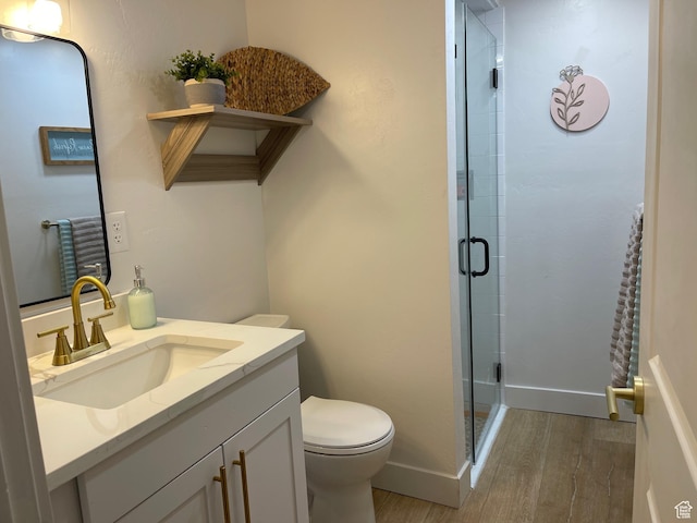 3444 S 1100 E, Millcreek, UT 84106 - full bathroom with baseboards, wood finished floors, toilet, vanity, and a stall shower