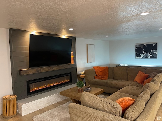 3444 S 1100 E, Millcreek, UT 84106 - living room with a textured ceiling, a fireplace, wood finished floors, and recessed lighting