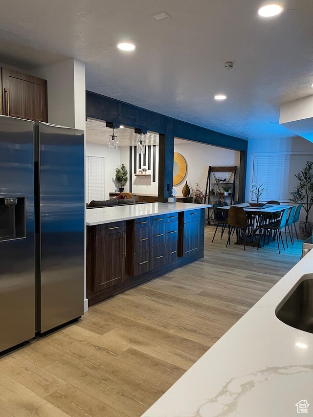 3444 S 1100 E, Millcreek, UT 84106 - kitchen featuring a sink, light wood-type flooring, stainless steel refrigerator with ice dispenser, recessed lighting, and dark brown cabinets