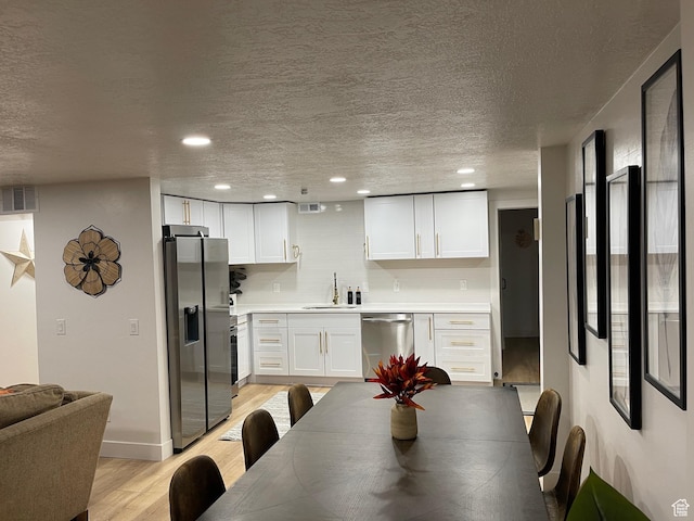 3444 S 1100 E, Millcreek, UT 84106 - dining space featuring light wood-style flooring, recessed lighting, a textured ceiling, and visible vents