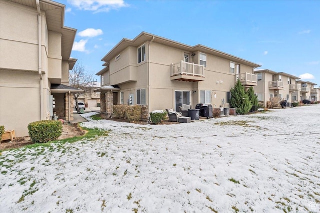 8464 S Ivy Springs Ln, West Jordan, UT 84081 - rear view of house featuring stucco siding, a residential view, and a balcony