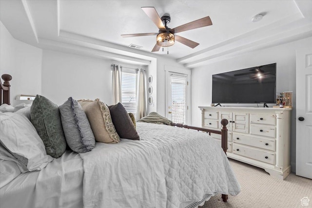8464 S Ivy Springs Ln, West Jordan, UT 84081 - bedroom with a tray ceiling, visible vents, light carpet, and a ceiling fan