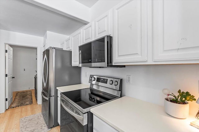 8464 S Ivy Springs Ln, West Jordan, UT 84081 - kitchen with white cabinetry, light countertops, light wood-style flooring, and stainless steel appliances