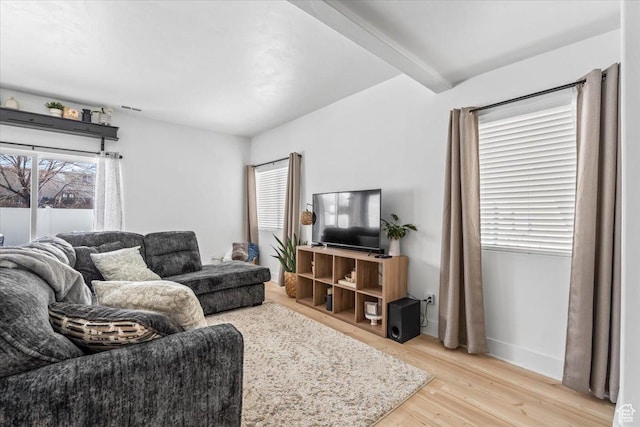 8464 S Ivy Springs Ln, West Jordan, UT 84081 - living room with baseboards, light wood-style floors, and beamed ceiling