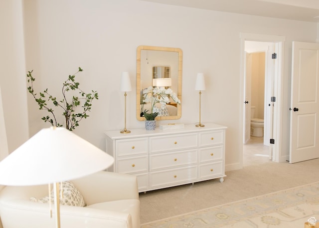 living area featuring light carpet