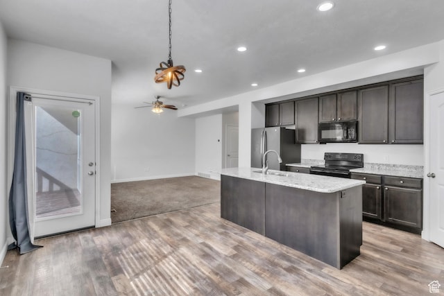 14292 S Autumn Path Ln W, Riverton, UT 84096 - kitchen with black appliances, recessed lighting, and dark brown cabinets