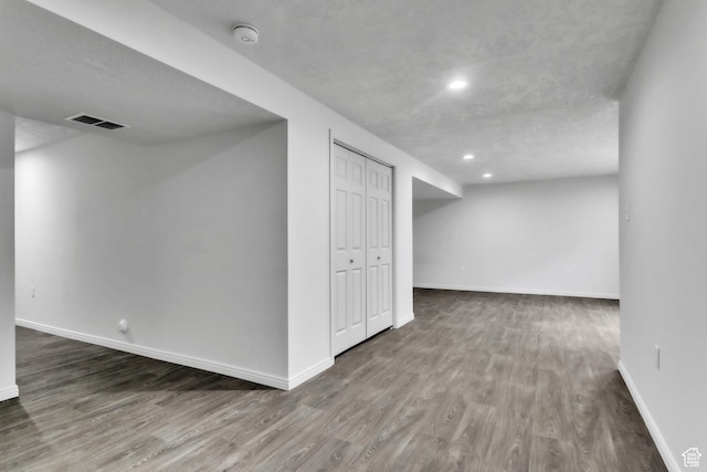 14292 S Autumn Path Ln W, Riverton, UT 84096 - finished below grade area featuring recessed lighting, baseboards, visible vents, and wood finished floors