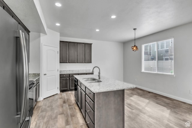 14292 S Autumn Path Ln W, Riverton, UT 84096 - kitchen with freestanding refrigerator, recessed lighting, a sink, and light wood finished floors
