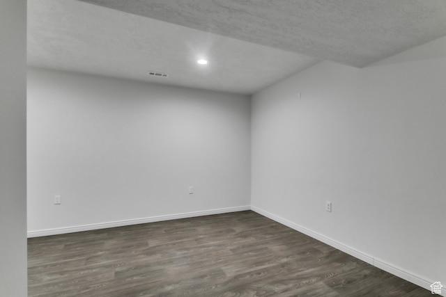 14292 S Autumn Path Ln W, Riverton, UT 84096 - unfurnished room featuring recessed lighting, baseboards, dark wood-style floors, and visible vents