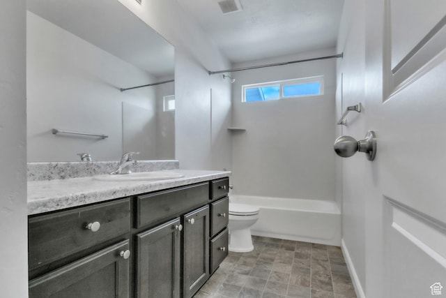 14292 S Autumn Path Ln W, Riverton, UT 84096 - bathroom featuring visible vents, vanity, toilet, baseboards, and shower / bathing tub combination