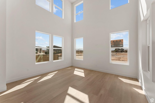 518 W Olive Ln, St George, UT 84790 - unfurnished room with light wood-type flooring and a high ceiling