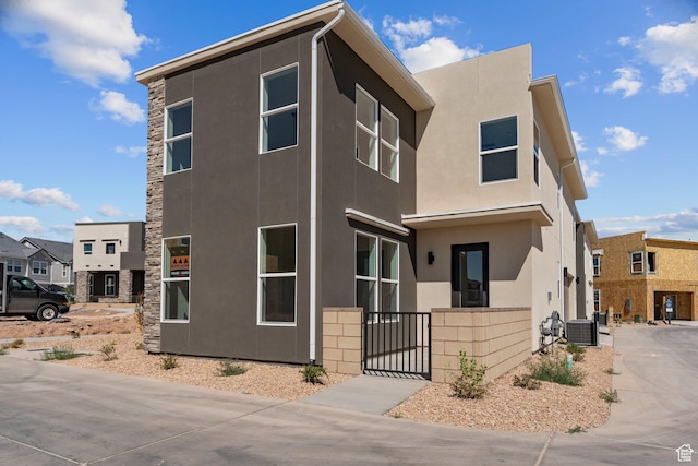 518 W Olive Ln, St George, UT 84790 - view of front facade featuring stucco siding, a gate, and stone siding