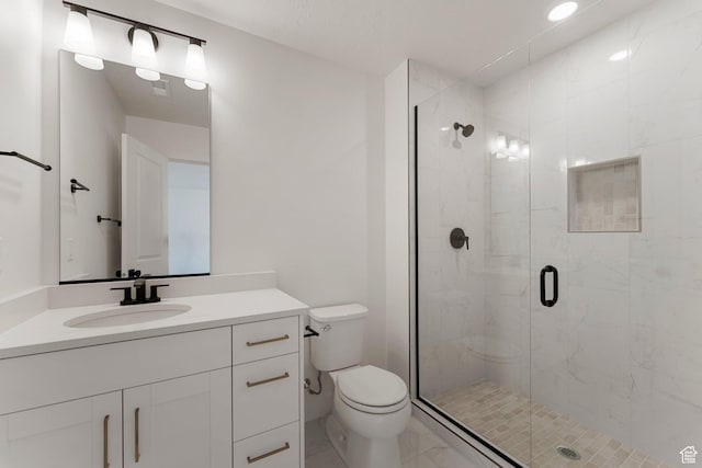 518 W Olive Ln, St George, UT 84790 - bathroom with marble look tiles, vanity, a shower stall, and recessed lighting