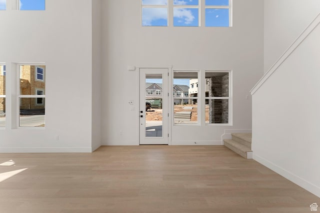 518 W Olive Ln, St George, UT 84790 - foyer entrance featuring a high ceiling, light wood finished floors, and stairs