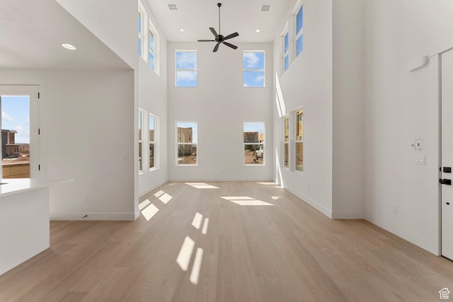 518 W Olive Ln, St George, UT 84790 - unfurnished living room with a ceiling fan, light wood-style flooring, recessed lighting, and a high ceiling