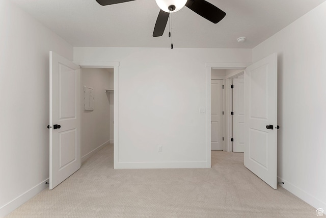 518 W Olive Ln, St George, UT 84790 - unfurnished bedroom with light carpet, a spacious closet, ceiling fan, and a closet
