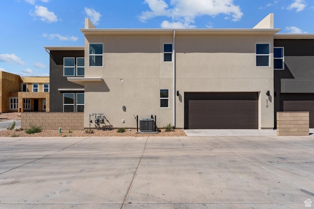 518 W Olive Ln, St George, UT 84790 - back of house featuring concrete driveway, stucco siding, and a garage