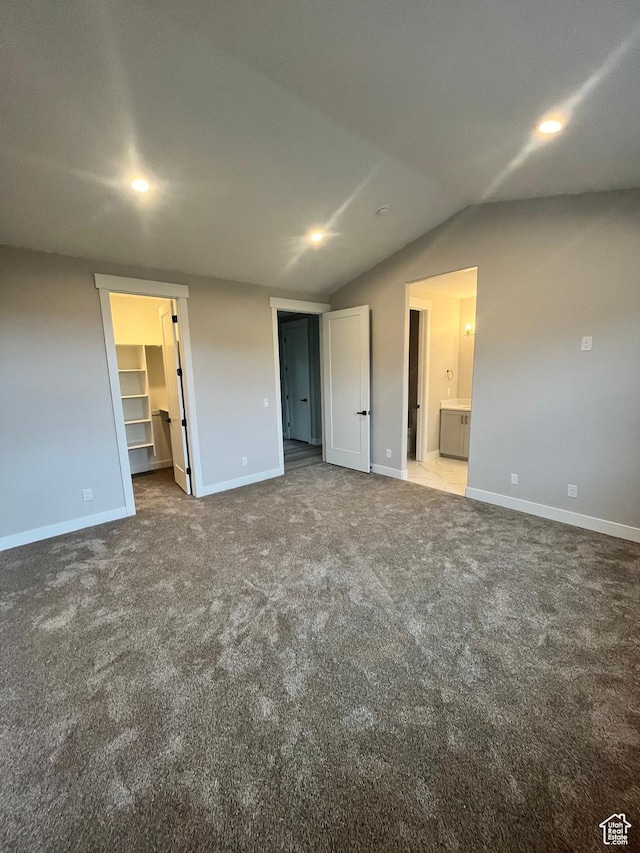 335 E 340 S, Kamas, UT 84036 - unfurnished bedroom featuring vaulted ceiling, a spacious closet, carpet flooring, baseboards, and ensuite bath