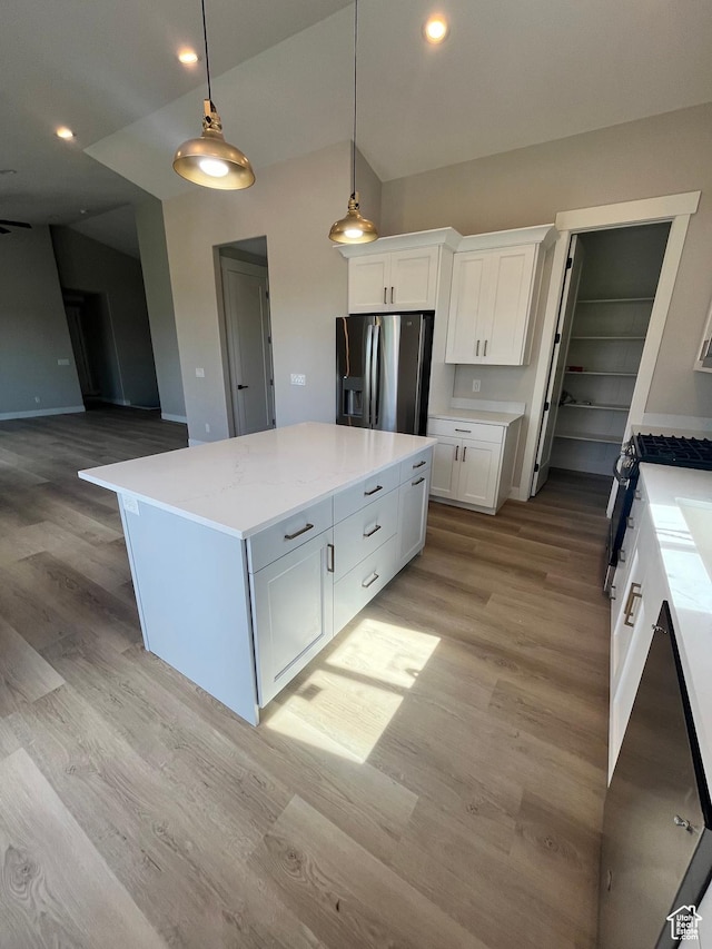 335 E 340 S, Kamas, UT 84036 - kitchen with white cabinets, stainless steel refrigerator with ice dispenser, lofted ceiling, and light wood finished floors