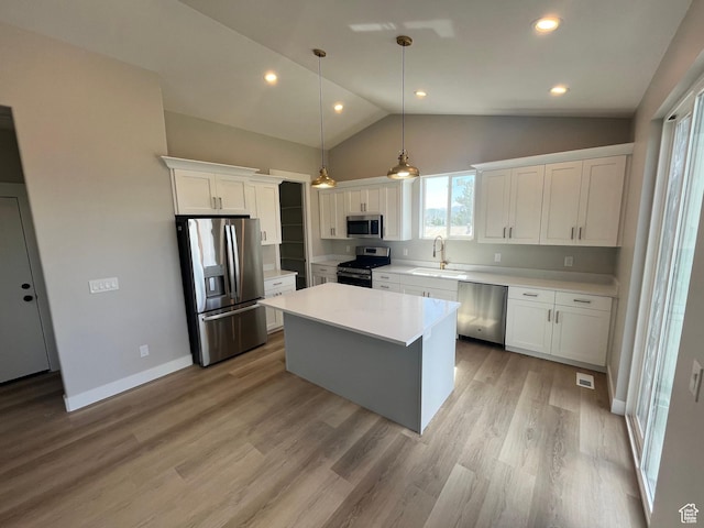 335 E 340 S, Kamas, UT 84036 - kitchen featuring white cabinetry, light countertops, a center island, a sink, and appliances with stainless steel finishes