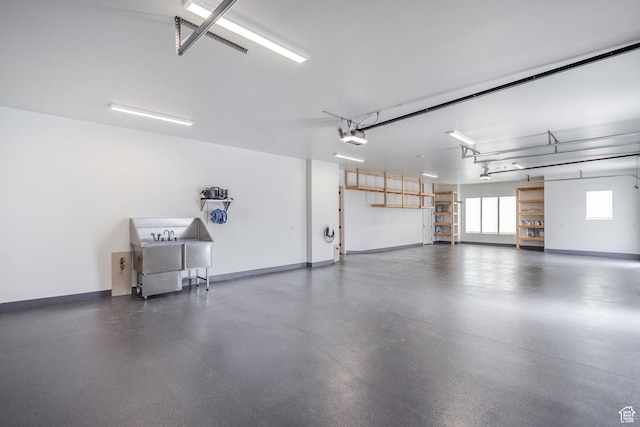 13926 S Jarvie Ln E, Draper, UT 84020 - garage with baseboards and a garage door opener