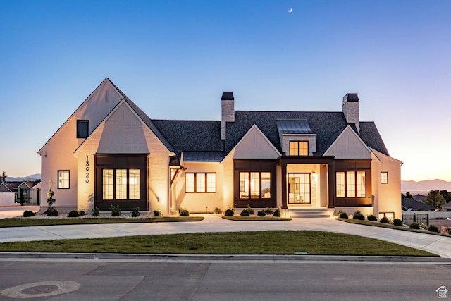 13926 S Jarvie Ln E, Draper, UT 84020 - back of house featuring a standing seam roof, a chimney, and curved driveway