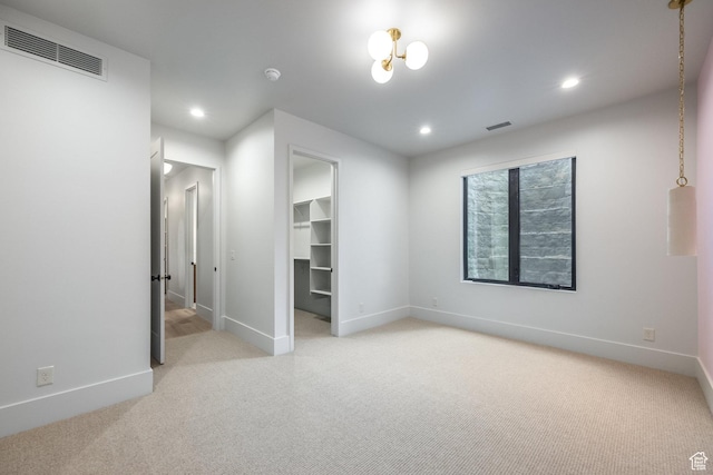 13926 S Jarvie Ln E, Draper, UT 84020 - unfurnished bedroom featuring visible vents, baseboards, recessed lighting, light carpet, and a spacious closet
