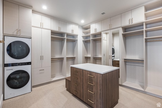 13926 S Jarvie Ln E, Draper, UT 84020 - spacious closet with light colored carpet, visible vents, and stacked washer / drying machine