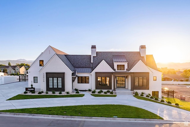 13926 S Jarvie Ln E, Draper, UT 84020 - modern inspired farmhouse featuring a standing seam roof, a chimney, metal roof, and a mountain view