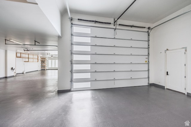 13926 S Jarvie Ln E, Draper, UT 84020 - garage with baseboards and a garage door opener
