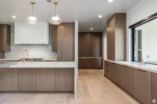 13926 S Jarvie Ln E, Draper, UT 84020 - kitchen featuring a sink, modern cabinets, and light wood-style floors