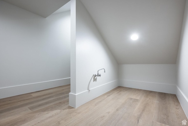 13926 S Jarvie Ln E, Draper, UT 84020 - additional living space featuring baseboards, light wood-style floors, and lofted ceiling