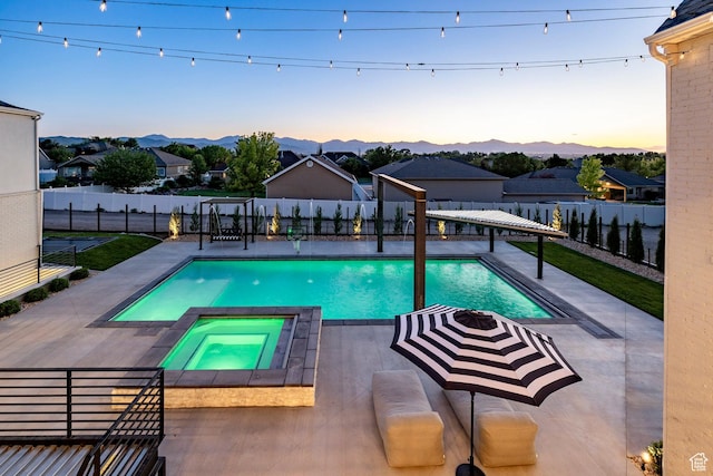 13926 S Jarvie Ln E, Draper, UT 84020 - view of swimming pool featuring a fenced backyard, a patio area, a mountain view, and a pool with connected hot tub
